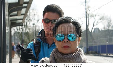 Asian Chinese Tourist Travel In Europe During Hoiday. Famous Destination Of Visitor From Asia
