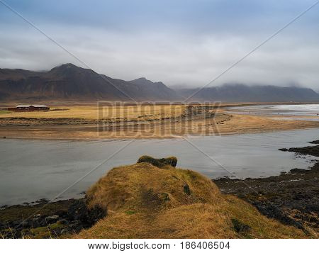 Landscape view of the big mountain and the grass field on the way to Reykholt autumn Iceland