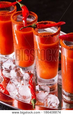 Bloody Mary Cocktail With Chili Pepper, Ice And Celery.