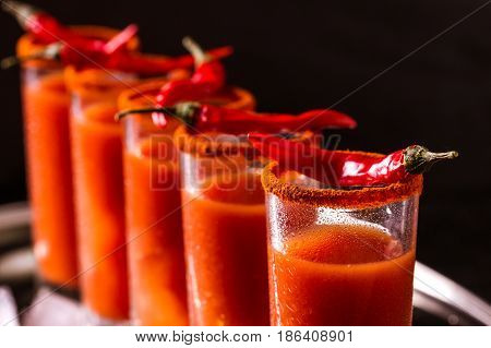 Bloody Mary Cocktail With Chili Pepper, Ice And Celery.