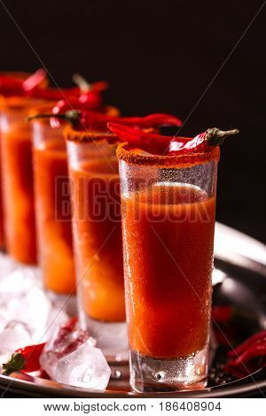 Bloody Mary Cocktail With Chili Pepper, Ice And Celery.