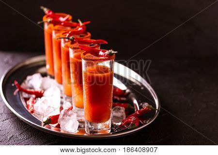 Bloody Mary Cocktail With Chili Pepper, Ice And Celery.