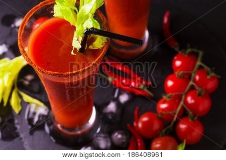 Bloody Mary Cocktail With Chili Pepper, Ice And Celery.