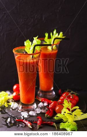 Bloody Mary Cocktail With Chili Pepper, Ice And Celery.