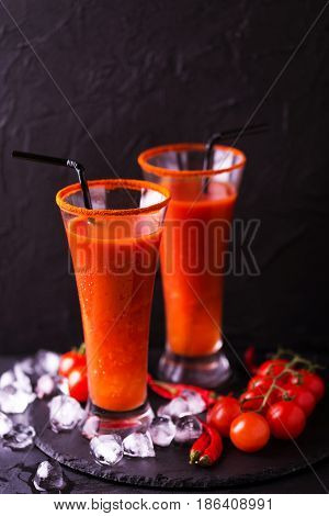 Bloody Mary Cocktail With Chili Pepper, Ice And Celery.