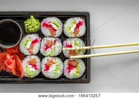 The Plate Of Sushi With Soy Sauce, Wasabi And Chopsticks