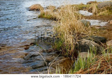 Russia. Leningrad region. Losevo. On the Vuoksa river a rocky shore with rapids and a bridge