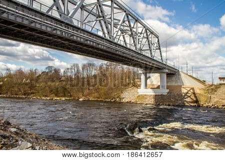 Russia. Leningrad region. Losevo. On the Vuoksa river a rocky shore with rapids and a bridge