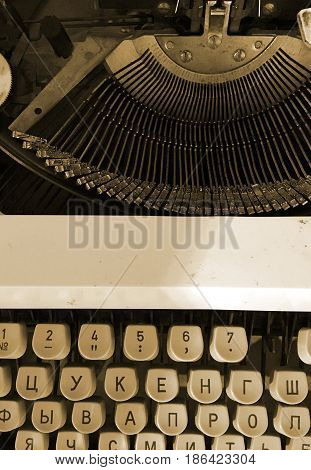 Old retro typewriter vintage background with cyryllic alphabet keys