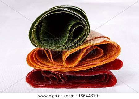 Tklapi - dried mashed fruit pulp / Colorful fruit leather from apricot kiwi dogwood. Georgian and Armenian cuisine.