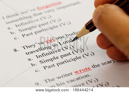 closeup english exam sheet on table with pencil