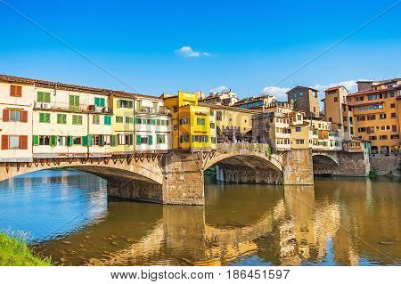 Famous Ponte Vecchio With River Arno At Sunset In Florence, Italy