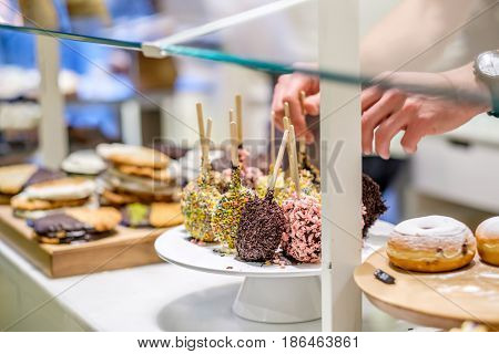 Donuts in assortment at confectionery store