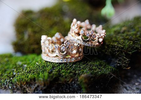 Wedding rings in the shape of a crown with jewels