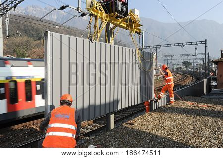 Workers During The Installation Of Noise Barriers On The Railway