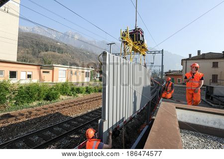 Workers During The Installation Of Noise Barriers On The Railway
