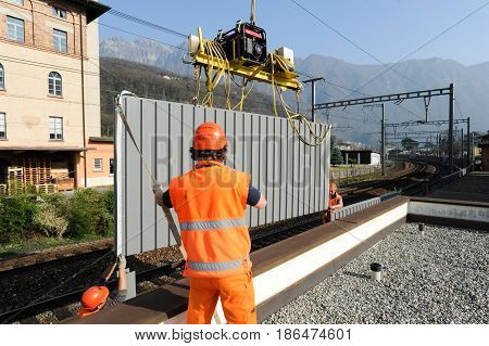 Workers During The Installation Of Noise Barriers On The Railway