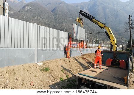 Workers During The Installation Of Noise Barriers On The Railway