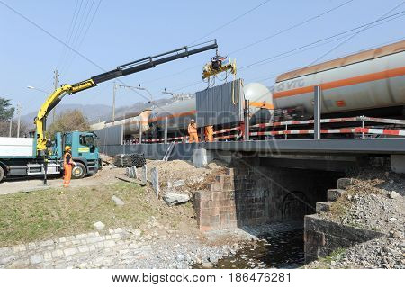 Workers During The Installation Of Noise Barriers On The Railway