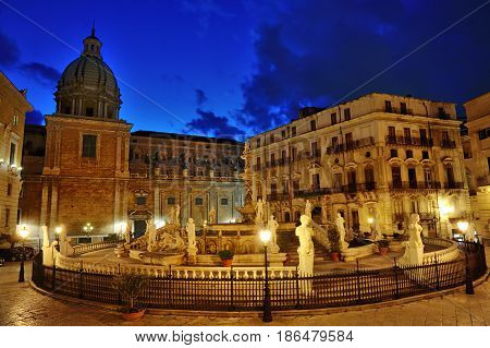 Famous baroque Fountain of shame on Piazza Pretoria at night Palermo Sicily Italy Europe