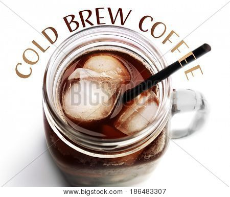 Glass jar of cold brewed coffee on white background