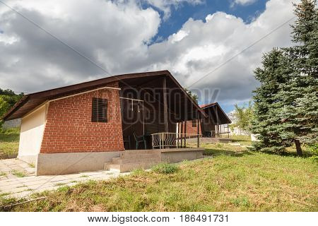 Wooden bungalows and garden in the forest. Holiday apartmens
