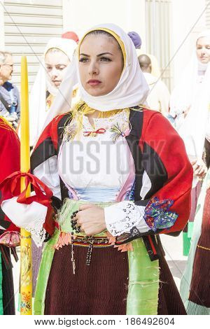 CAGLIARI, ITALY - MAY 1, 2017: 361 Religious procession of Sant'Efisio - portrait of a beautiful woman dressed in traditional Sardinian costume - Sardinia