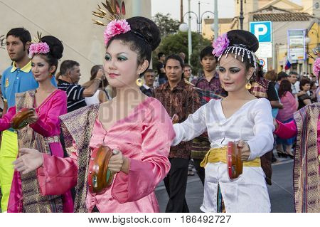 QUARTU S.E., ITALY - JULY 14, 2012: International Festival of Folklore - 26 Sciampitta, Sardinia - parade of the folk group of Jakarta, Indonesia