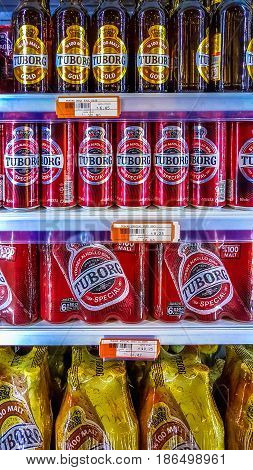 Eskisehir Turkey - March 15 2017: Tuborg beer cans and bottles on the shelf at the supermarket