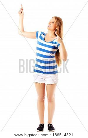 Young woman pointing to somewhere, isolated over a white background