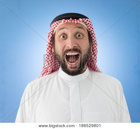 portrait of an amazed young muslim man
