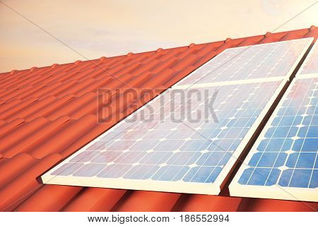 3D illustration solar panels on a red roff, power generation technology. Alternative energy. Solar battery panel modules with scenic sunset with blue sky with sun light