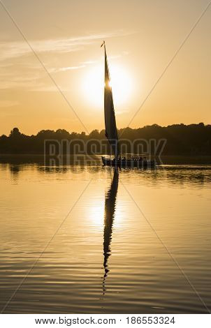 Traditional Felluca Sailing Boat Silhouette At Sunset