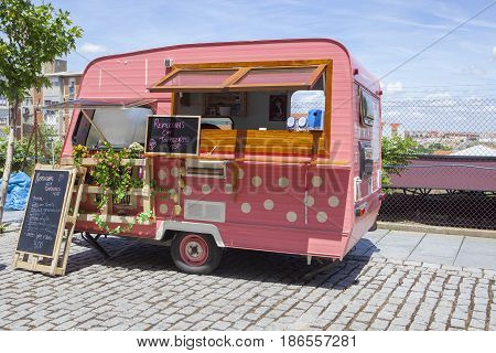 Merida Spain - May 14 2017: Pink dotted food truck at the historical city of Merida Extremadura Spain