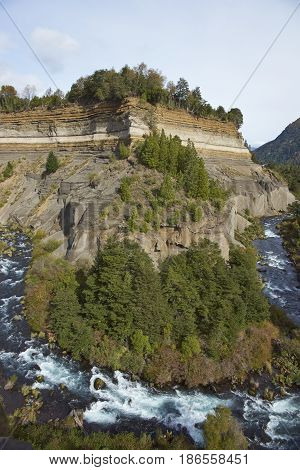 River Truful-Truful running through a deep gorge with colourful eroded cliffs in Conguillio National Park in the Araucania region of Chile