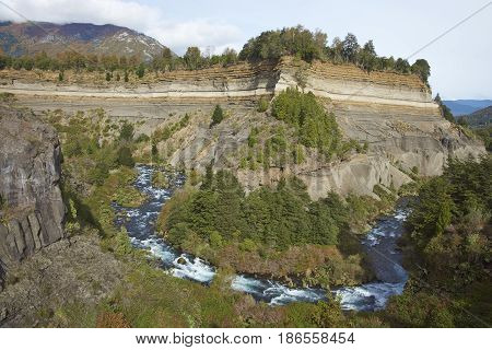 River Truful-Truful running through a deep gorge with colourful eroded cliffs in Conguillio National Park in the Araucania region of Chile