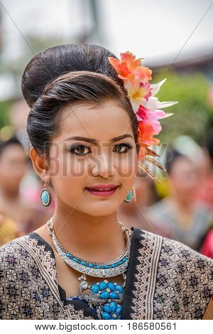 NAKORN PHANOM THAILAND - FEBRUARY 14 2015: Thai northeastern Phutai dancers with traditional costume in Phutai world event day in Renunakorn of Nakorn Phanom Thailand.