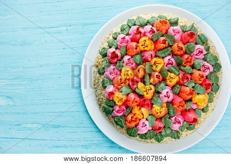 Beautiful birthday cake on blue background top view