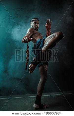 Low Angle View Of Determined Muay Thai Fighter Training Thai Boxing, Ultimate Fight Concept