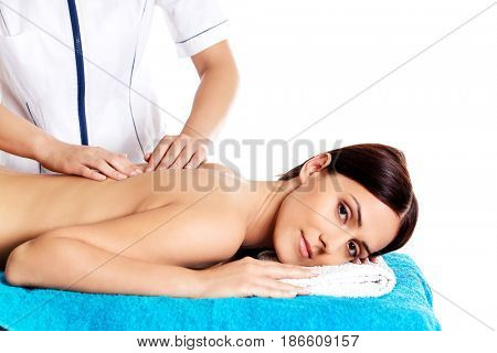 Woman having massage of body in the spa salon. Beauty treatment concept.