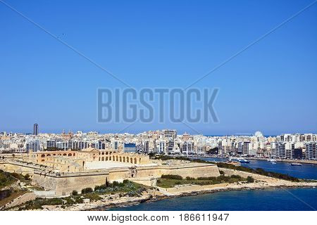VALLETTA, MALTA - MARCH 30, 2017 - Elevated view of Manoel Fort on Manoel Island seen from Valletta with Sleima to the rear Valletta Malta Europe, March 30, 2017.
