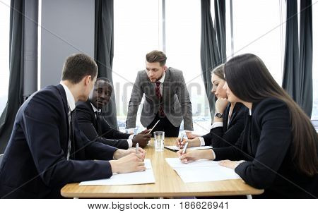 Manager yelling at his employees at the meeting. Company is in recession
