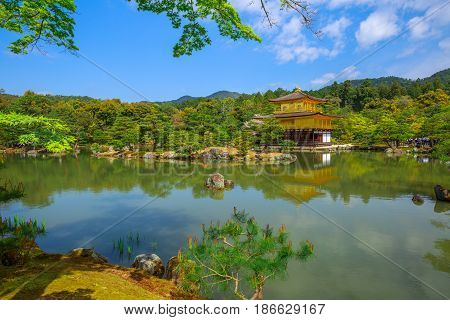 Kinkaku-ji, Golden Pavilion, famous buddhist temple zen of Rinzai sect in Kyoto reflected in the lake. The Rokuonji is one of most visited Kyoto temples. Concept of Buddhism and meditation.