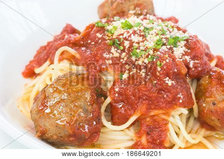 Beef and Lamb meatball pasta over white background