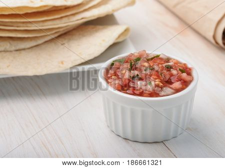 Ramekin with salsa fresca sauce and flatbread