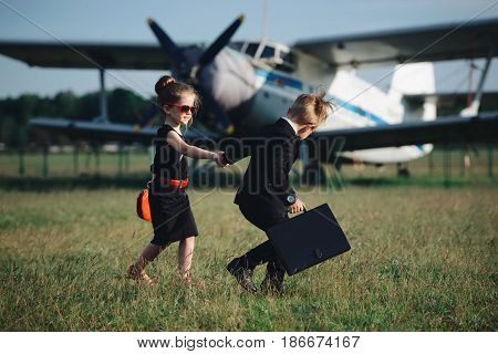 photo of young boy and girl playing spy