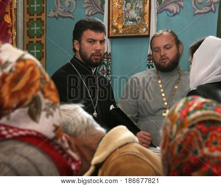 VOYUTYN UKRAINE - 14 October 2008: Priests and parishioners of the Orthodox Church during the religious celebration Pokrov