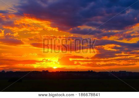 Beautiful summer sunset over a provincial town. Shooting from out of town