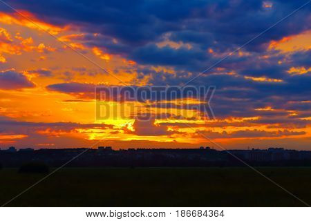 Beautiful summer sunset over a provincial town. Shooting from out of town