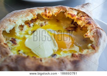 Adjarian Khachapuri With Eggs On The Table